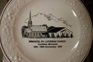 Church plate A commemorative plate shows the old and new Immanuel churches and celebrates the congregation's 150th anniversary.