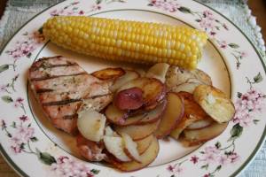 The perfect summer meal: baby potatoes and sweet corn from the Faribault Farmers' Market and a grilled pork chop