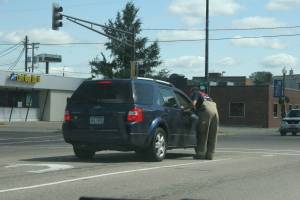 Seeking donations A Faribault firefighter seeks donations while standing in the traffic lane of busy N.W. Fourth Street.