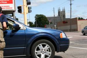 MDA drive My husband rolled down the driver's side window as we passed this car and firefighter in the turning lane of N.W. Fourth Street.