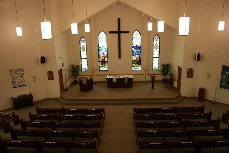 A view of Immanuel from the church balcony. The pews, the chancel furnishings and the stained glass windows from the old church were incorporated into the new church.