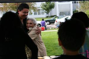 Family embrace A man, probably a family member, embraces the old woman.
