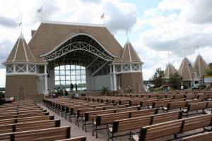  A couple dances upon the stage of the bandshell.