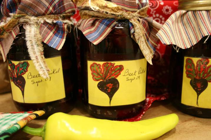 Jars of pickled beets on display.
