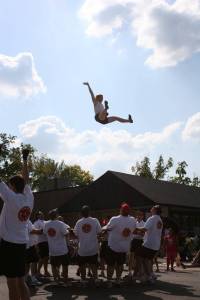 Members of the St. Paul bouncing team entertained parade watchers when a member bounced off a blanket.