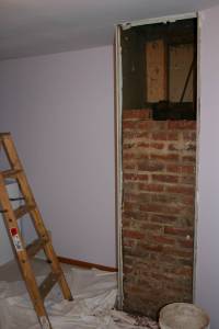 We removed a piece of sheetrock to access the chimney in an upstairs bedroom. One project leads to another as we'll need to patch the floor replace the wall and repaint the room