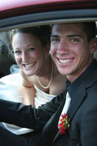 Kristina and Corey Leaving the church in the bridal car, Kristina and Corey.
