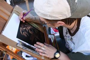 Laura J. Grote of Faribault set up her easel and worked on engraving a hummingbird.