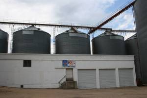 I like this photo because of how the three grain bins mimic the three doors on this building at the Nicollet Farmers Exchange Company.