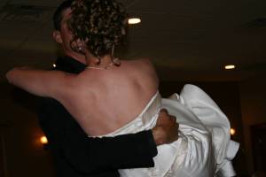 Wedding reception Corey carries his bride into the wedding reception.