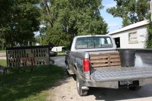 The Twiehoffs' pickup truck sits outside their produce-filled pole shed.