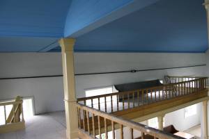 Blue ceiling Inside the 1862 church, restoration continues, including work on the balcony area. The blue color is historically correct to the original church.