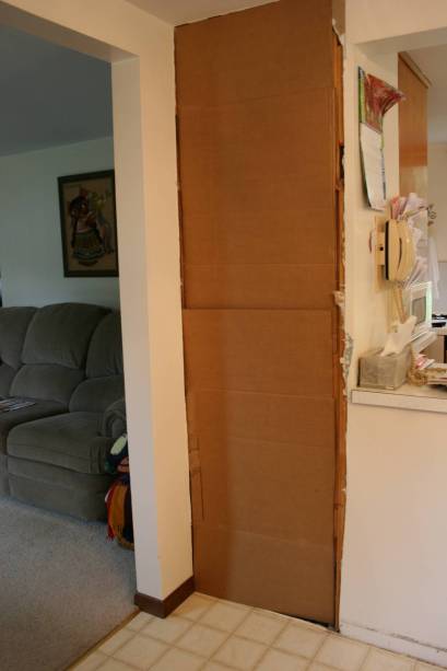 Little kids are temporarily banned from our house while this cardboard wall is in place in my dining room. Lean against this wall, and you will tumble into the basement.