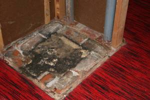 Finally, we reached the bottom of the chimney in the basement. And, yes, the red carpet has to go too.