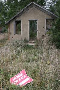 The "for sale" sign actually directs potential buyers to a house just down the road. But I thought the signs placement in front of this dilapidated school quite humorous.