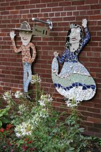 Mexico represented in a colorful wall-side mosaic of dancers.
