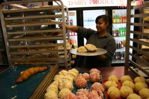 Selecting treats at Mariano Perez' bakery.