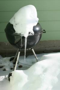 Snow-covered grill