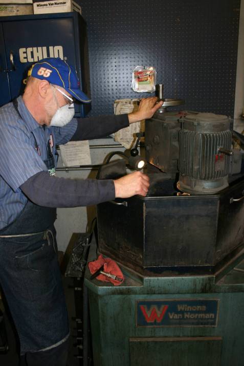 Randy grinds a flywheel.