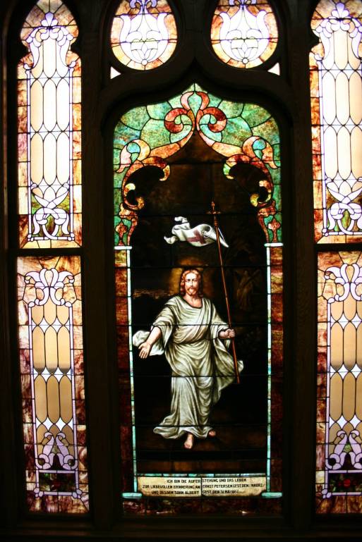 "I am the resurrection and the life." A stained glass window in the Trinity Lutheran Church sanctuary, Faribault, Minnesota.