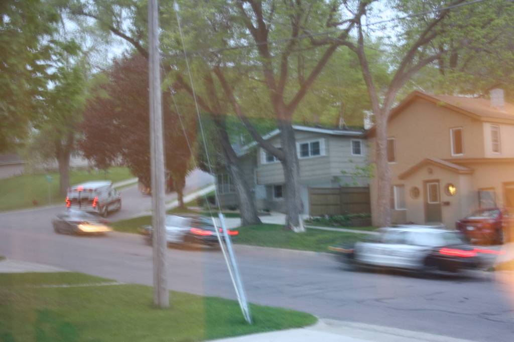 A Rice County sheriff squad and two Faribault police cars follow the SWAT team and ERU vehicle up First Avenue Southwest.