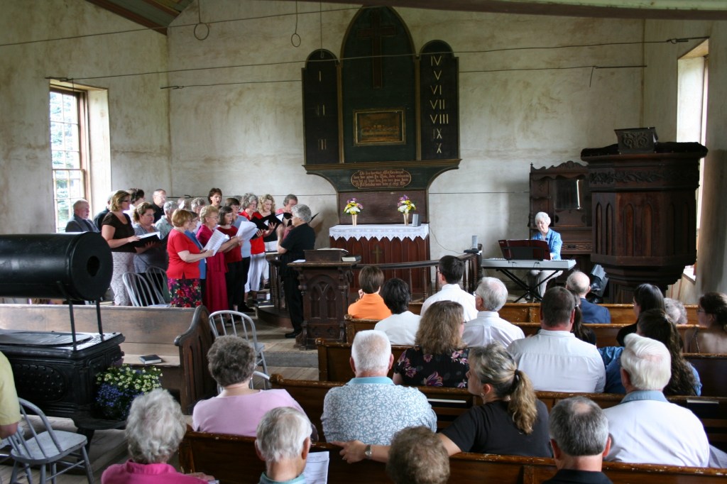 During a worship service filled with music, choir and congregational members sing in Norwegian, "Ja, vi elsker."