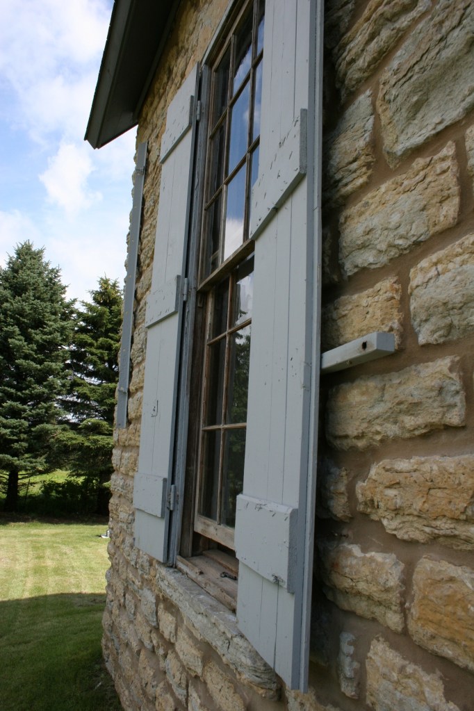 Old Stone Church, shuttered window