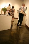 Visitors peruse “Shoe Stories” on the exhibit’s opening&nbsp;night.