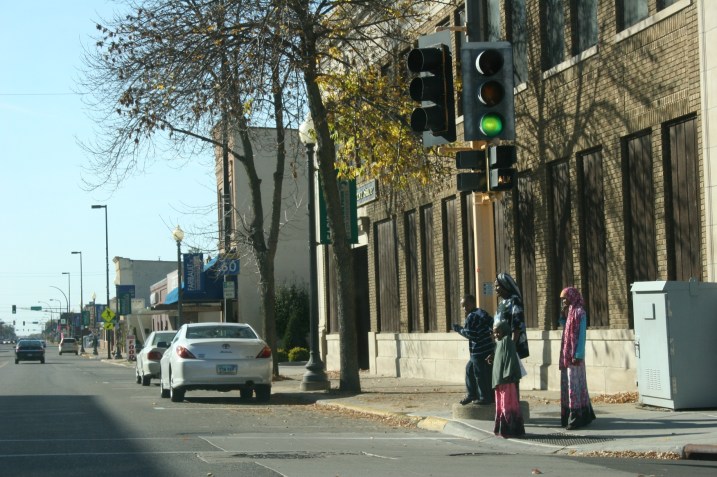 In this file photo, a Somali family waits to cross a downtown Faribault street.