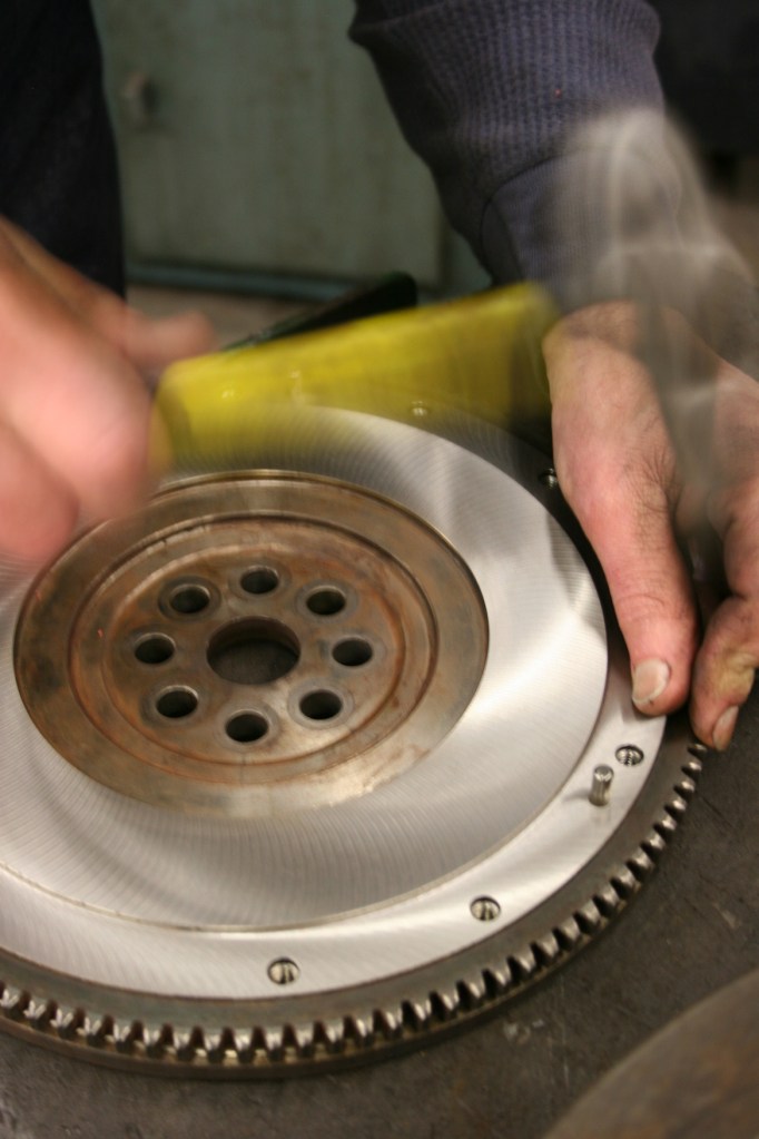 My husband at work with a hammer, a tool he uses often as an automotive machinist.