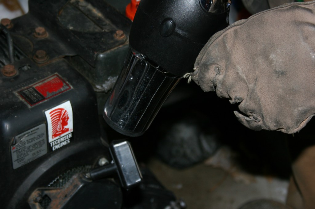 Using a hair dryer to thaw snowblower