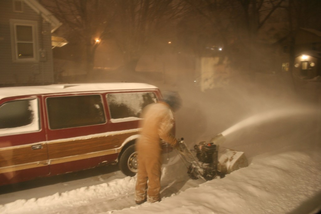Clearing snow from driveway.