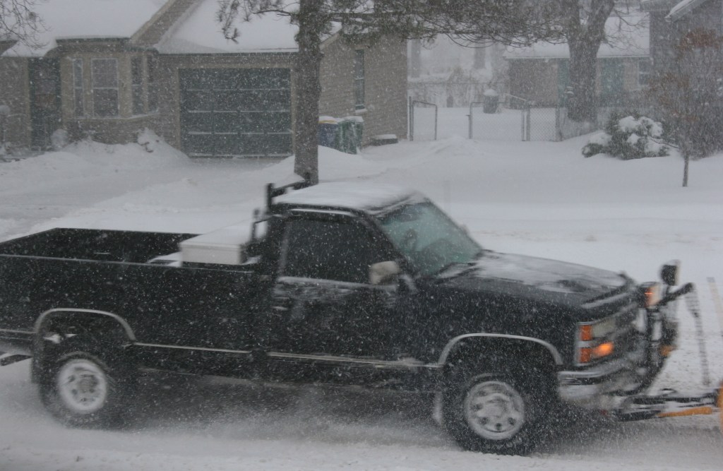 Pickup with attached snowplow