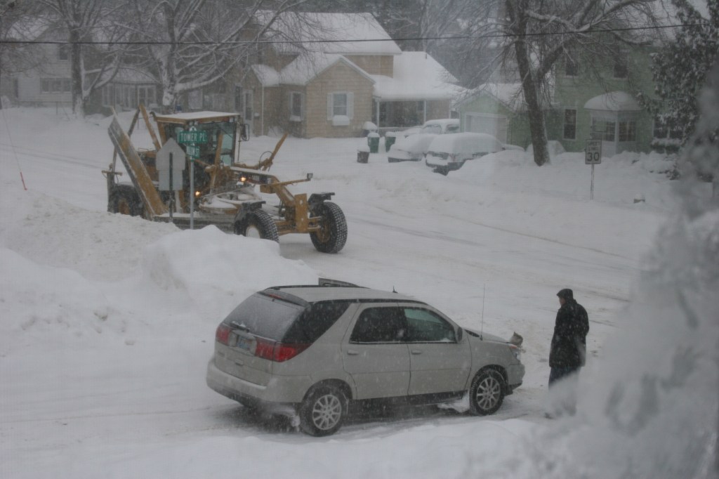 Grader and vehicle collision