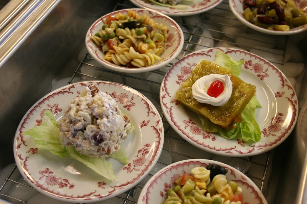 A few of the salad bar choices, including a tangy rhubarb square in the upper right of this photo.