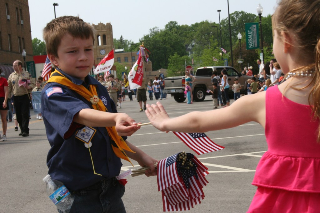 Boy Scout giving flag