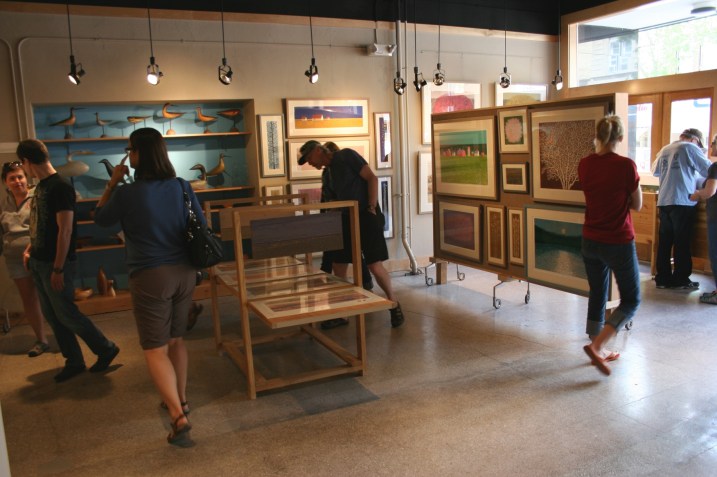 Visitors to the Kaddatz Galleries in downtown Fergus Falls peruse the art of Charles Beck.