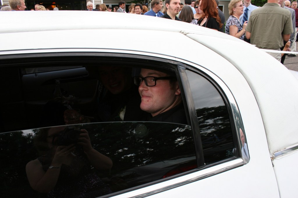 Wedding, groomsman in limo