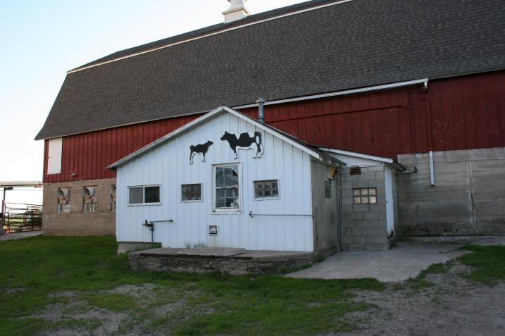 Notice the cow art on the milkhouse in this image taken this past summer.