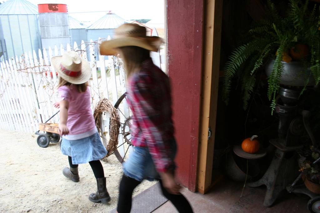 Barn, cowgirls running