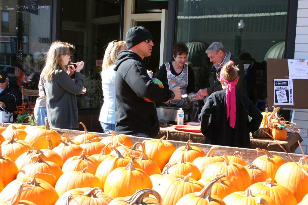 Participants in last year's Chili Contest dish up chili at a business along Central Avenue during the Fall Festival.