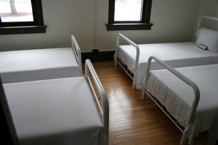 Beds were packed tight into sparse bedrooms in the cottage.