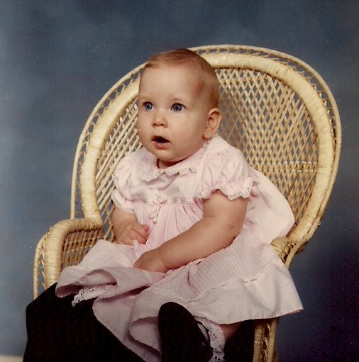Amber in 1986, sometime during her first year of life. The photo is not dated. A friend told me she looked just like the baby on the Gerber baby food jars.