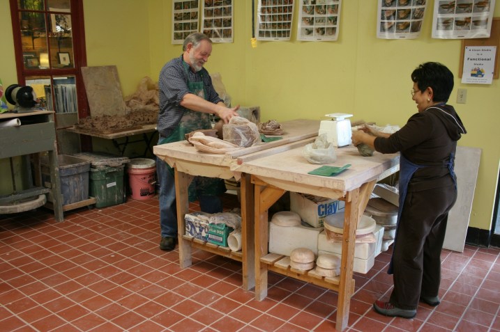 Joel Moline and Thalia Taylor kneading clay during a visit to the Clay Center in March 2012..