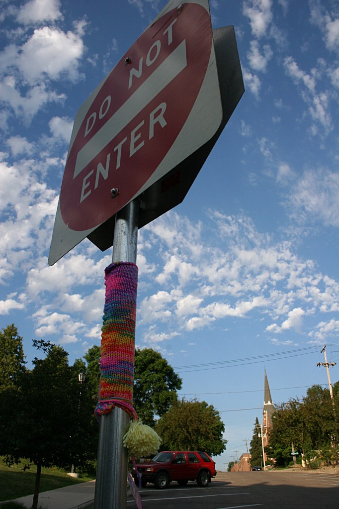 Art, on sign by library