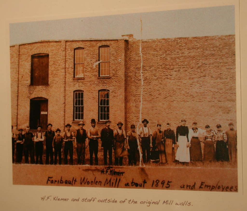 An historic photo from the mill, among those showcased in a mini wall of Woolen Mill history.