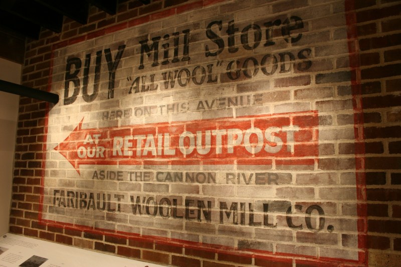 A replica of an original sign is now in the Woolen Mill's historic display area.