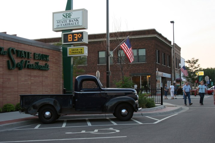 Car, black pickup by bank