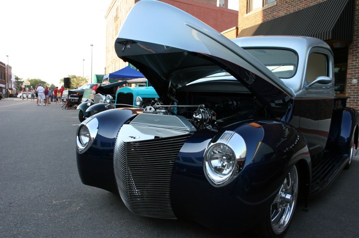 Car, blue truck, hood up
