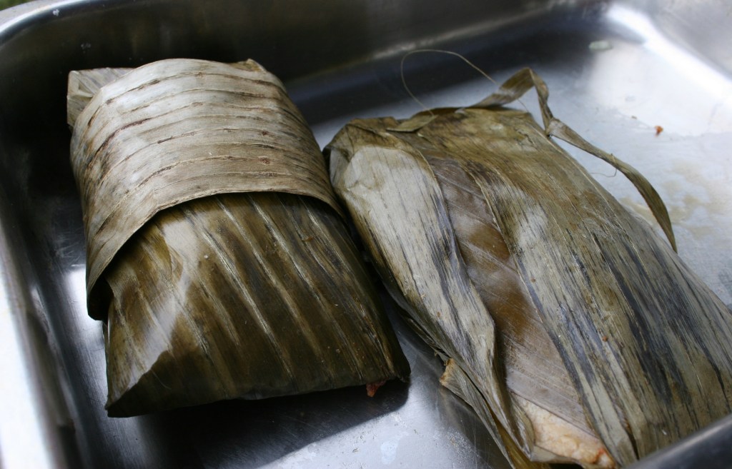 A Mexican dish (help me out if you know, but I think tortillas) was wrapped in banana leaves. My husband and I tried this.